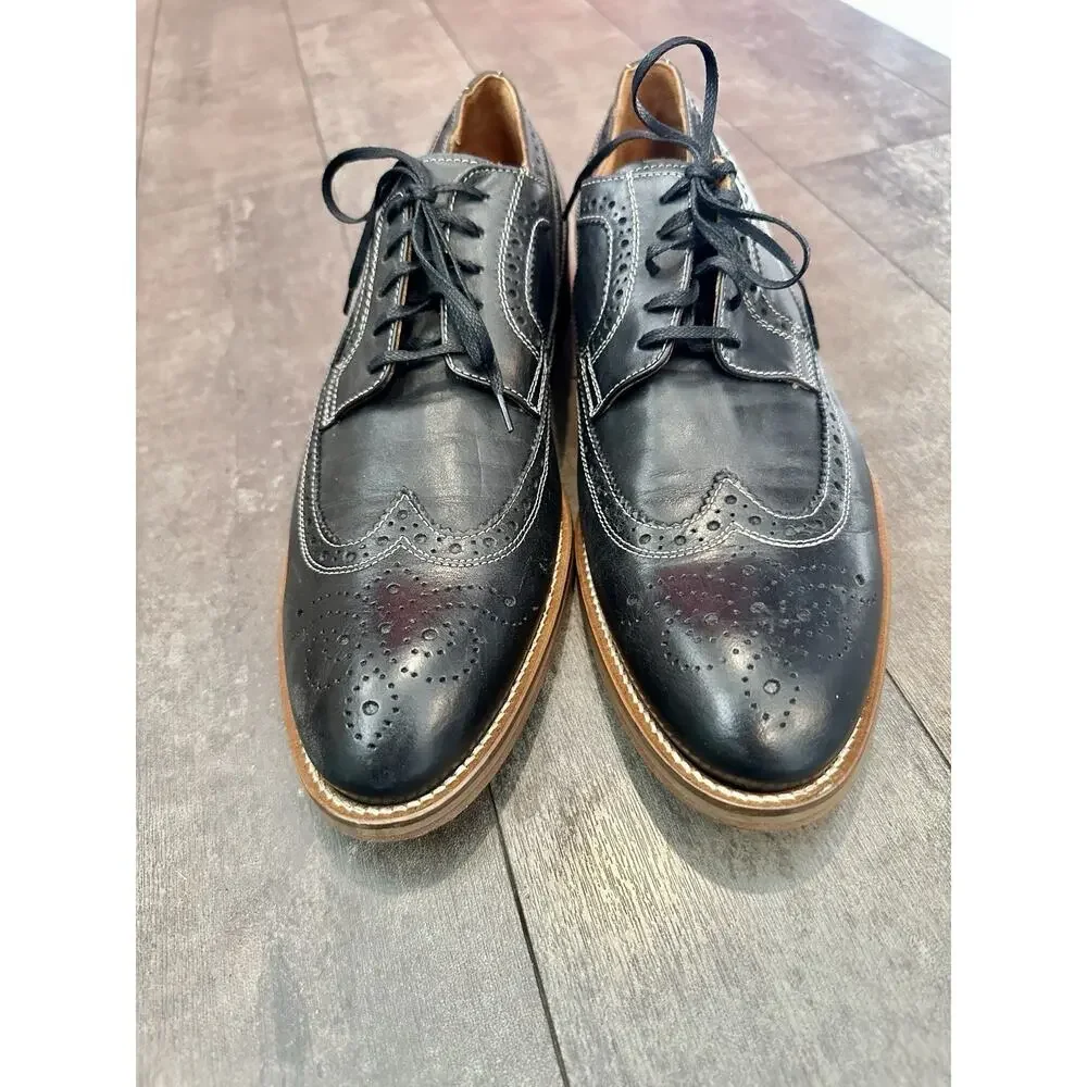 Johnston & Murphy Mens Conrad Wingtip Black Leather Oxford Shoes.